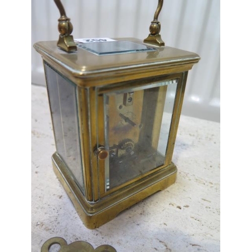  A brass carriage clock the dial signed Ross & Son - working with key