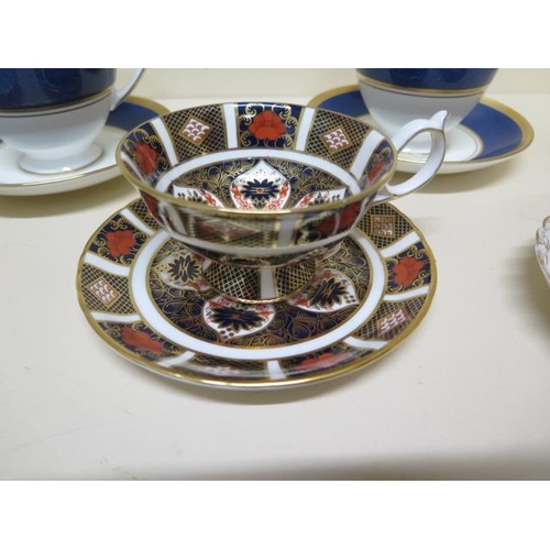 271 - A Crown Derby Imari 1128 cup and saucer, a Caverswall blue tit cup and saucer, a Dresdan cup and sau... 