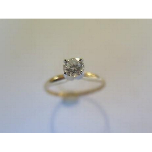 104 - A 14ct yellow gold solitaire ring - the round brilliant cut diamond 0.52ct, VVS2, colour I - ring si... 