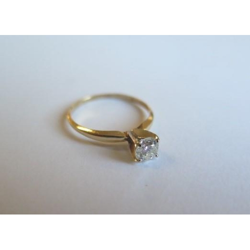 104 - A 14ct yellow gold solitaire ring - the round brilliant cut diamond 0.52ct, VVS2, colour I - ring si... 