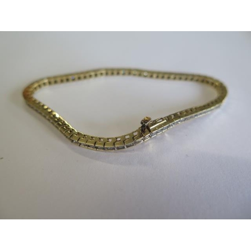 108 - A 14ct yellow gold diamond tennis bracelet - Length 18.5cm - approx weight 9.6 grams - good conditio... 