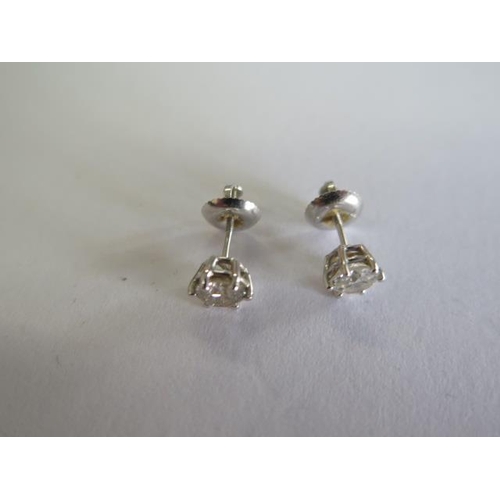 109 - A pair of 14ct white gold diamond earrings with screw backs, each approx 0.35ct - approx total weigh... 