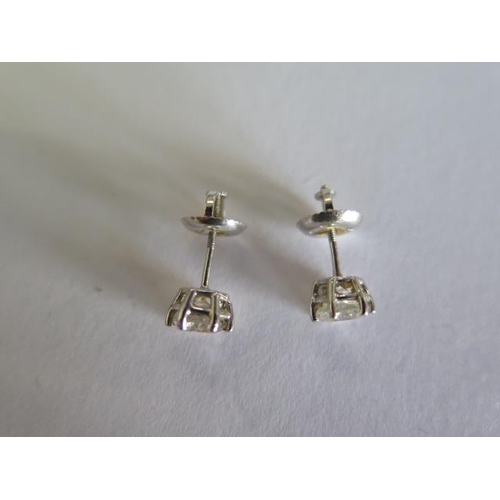 109 - A pair of 14ct white gold diamond earrings with screw backs, each approx 0.35ct - approx total weigh... 