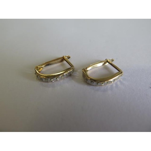 114 - A pair of 14ct yellow gold  earrings approx 14mm long, approx weight 1 gram total