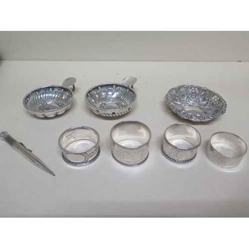 153 - Two Continental silver porringers - 77mm and 72mm diameter, four silver napkin rings, a silver penci... 