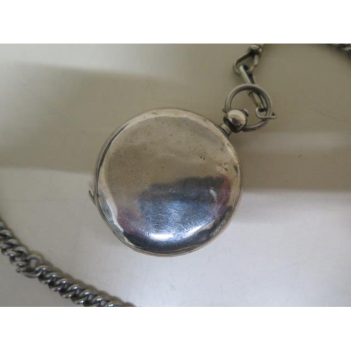 205 - A silver key wind pocket watch with chain - crack to dial but running - 50mm case - with key