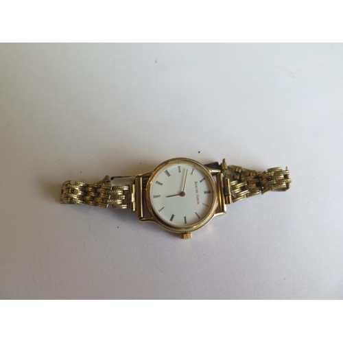 213 - A 9ct yellow gold Bueche Girod ladies quartz watch - 23mm case - on a plated bracelet strap - not cu... 