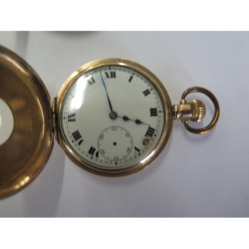 239 - An Elgin half hunter gold plated pocket watch, another similar half hunter and an open face plated w... 