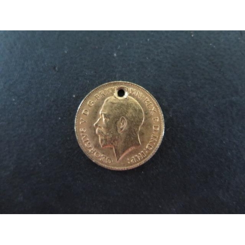 258D - A George V gold half sovereign dated 1914 - drilled hole