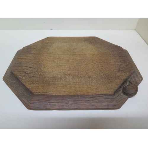 285 - A Thompson Mouseman of Kilburn octagonal breadboard - 31cm x 25cm - no splits or cracks, some utensi... 