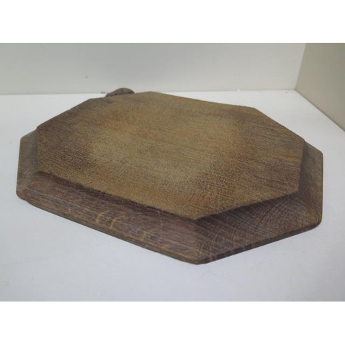 285 - A Thompson Mouseman of Kilburn octagonal breadboard - 31cm x 25cm - no splits or cracks, some utensi... 