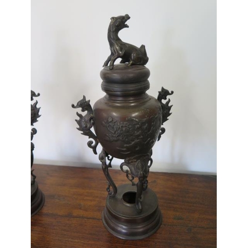 295 - A pair of Oriental bronze lidded censors on stands - Height 41cm - both with good patina