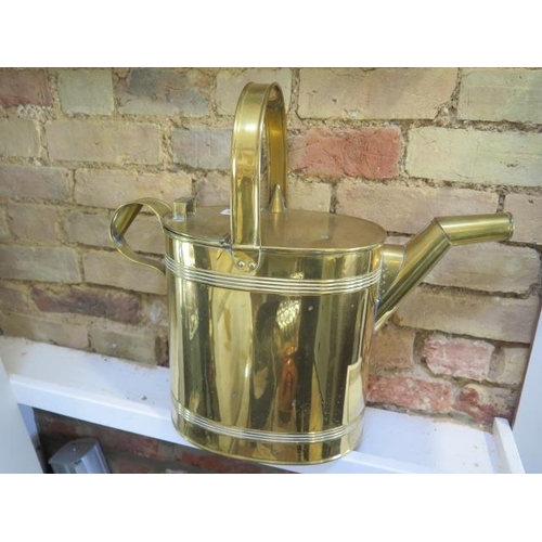 297 - A large brass watering can - Height 50cm x Width 53cm