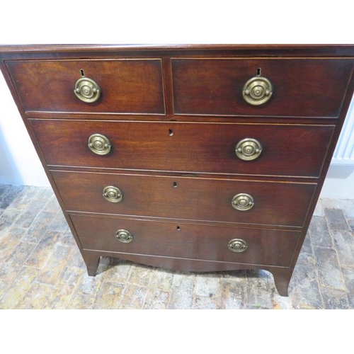 476 - An early 19th century mahogany chest with two short over three long drawers on splayed bracket feet ... 