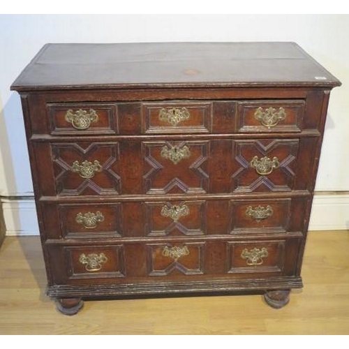 484 - An 18th century oak chest with four geometric drawers raised on bun feet - Width 96cm x Depth 55cm x... 