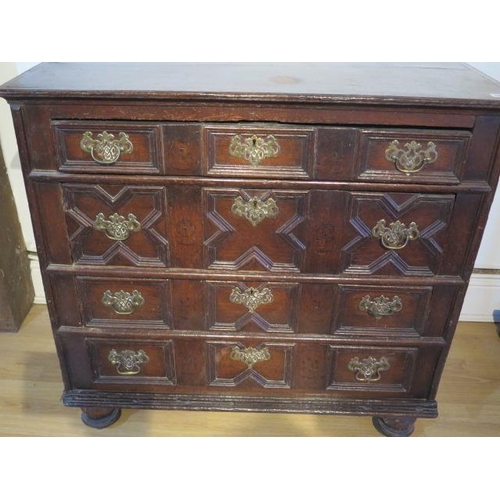 484 - An 18th century oak chest with four geometric drawers raised on bun feet - Width 96cm x Depth 55cm x... 