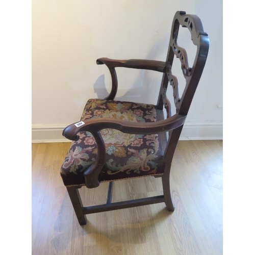 485 - A Georgian mahogany armchair with outswept arms on square legs - in sound condition with a nice pati... 