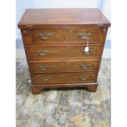 529 - A Georgian style walnut bachelors chest with a fold over top over four long drawers - Height 73cm x ... 