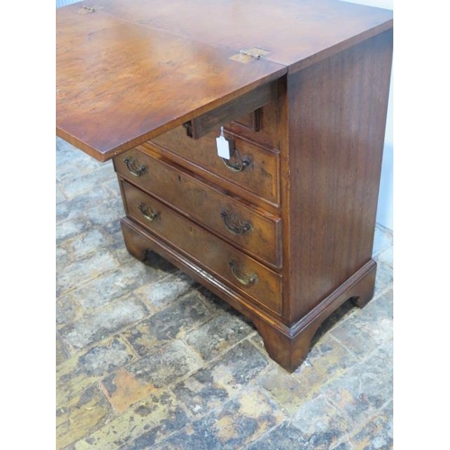 529 - A Georgian style walnut bachelors chest with a fold over top over four long drawers - Height 73cm x ... 