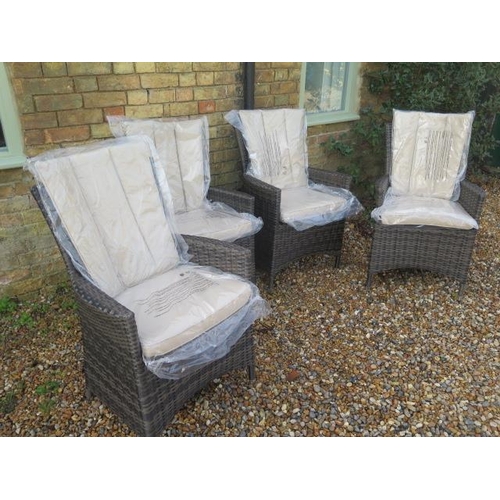 559 - A set of four new Maze Rattan garden chairs with cushions