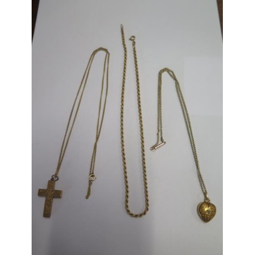 74 - A 9ct yellow gold crucifix on a 62cm 9ct chain, a 9ct chain 39cm long - total weight approx 16 grams... 