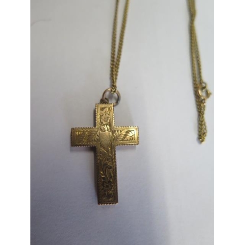 74 - A 9ct yellow gold crucifix on a 62cm 9ct chain, a 9ct chain 39cm long - total weight approx 16 grams... 