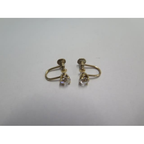 76 - A pair of diamond 9ct yellow gold screw back earrings - diamond weight approx 0.35ct - diamonds brig... 