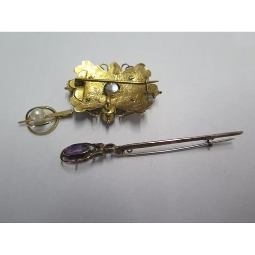 77 - A 9ct yellow gold pin brooch and two gilt metal brooches - one missing a flower - total weight appro... 