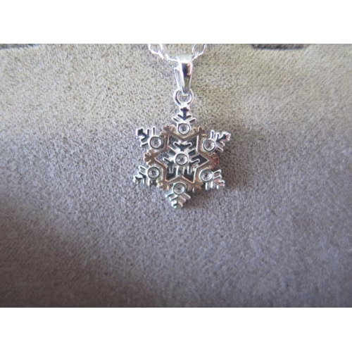 79 - A Clogau silver snowflake pendant and a Clogau silver cornflower pendant - ex jewellers stock - as n... 