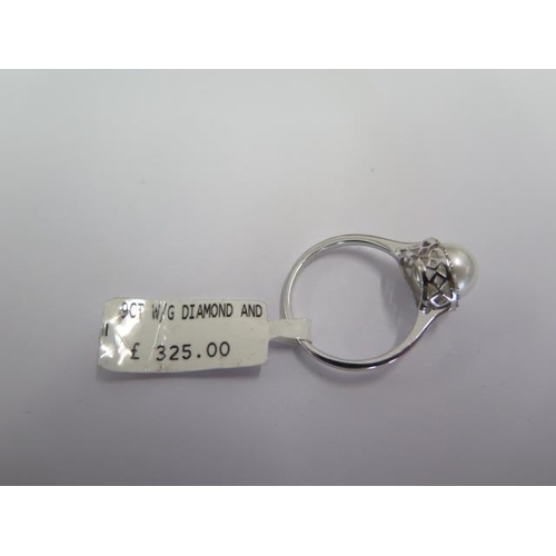 88 - A 9ct white gold diamond and pearl ring size N - approx weight 2.2 grams - ex jewellers stock - as n... 