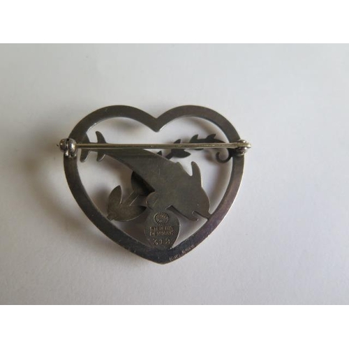 97 - A Georg Jensen sterling silver heart brooch with two dolphins no 312 - Width 43mm - in good conditio... 
