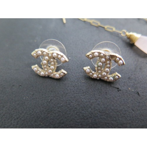 104A - A pair of Chanel pearl earrings and a pair of gilt metal amethyst earrings