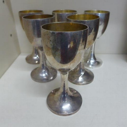 A set of six silver goblets - Height 19cm - London 1903/04 - total approx weight 53 troy oz - no engraving, one has dented stem, some minor dents and misshaping to others but reasonably good