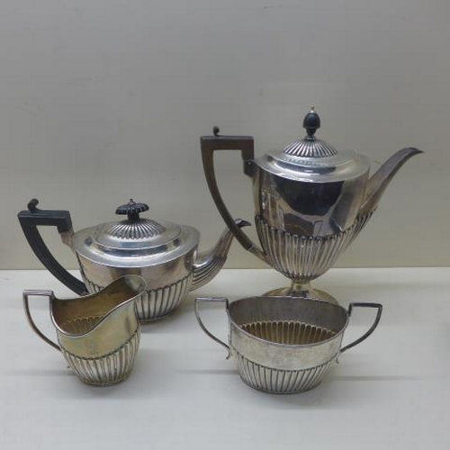 A matched silver four piece coffee/tea set - teapot and milk jug London CSH 1895/96 with armorial crest, sugar bowl Birmingham 1898/99 BB and coffee pot Sheffield 1892/93 WGJL - Total weight approx 42.8 troy oz - general wear but reasonably good
