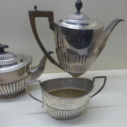 112 - A matched silver four piece coffee/tea set - teapot and milk jug London CSH 1895/96 with armorial cr... 