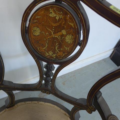 254 - A 19th century mahogany and rosewood inlaid armchair