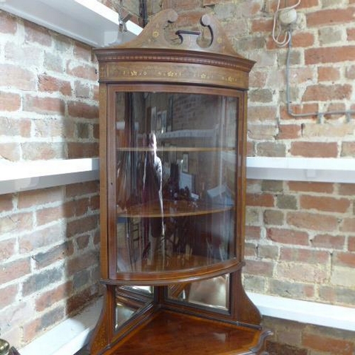 271 - A good quality Edwardian mahogany and inlaid corner cabinet with a bow fronted glazed door