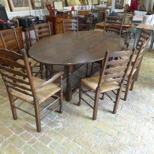 275 - A large oak wake table with eight chairs including two carvers - Length 227cm x Width 140cm