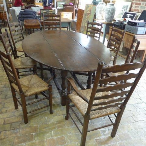 275 - A large oak wake table with eight chairs including two carvers - Length 227cm x Width 140cm