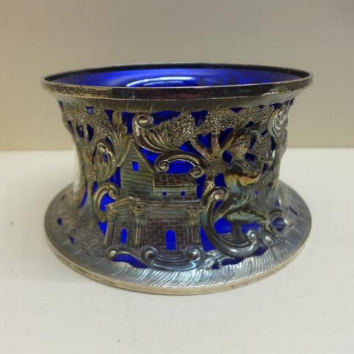 96 - An Irish silver Shepard and Shepardess fretwork silver sleeve with blue glass liner - Dublin 1932, T... 