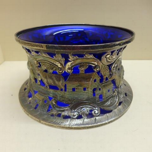 96 - An Irish silver Shepard and Shepardess fretwork silver sleeve with blue glass liner - Dublin 1932, T... 