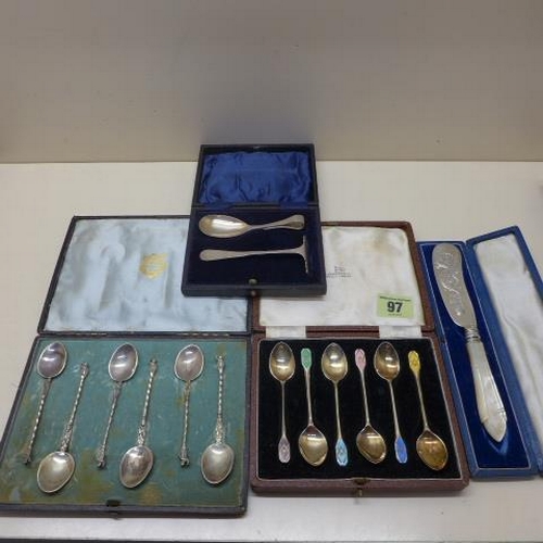 97 - A boxed set of six enamel silver Walker and Hall coffee spoons - generally good, silver pusher and s... 