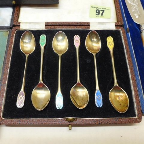 97 - A boxed set of six enamel silver Walker and Hall coffee spoons - generally good, silver pusher and s... 