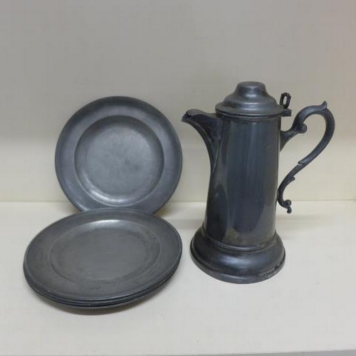 98 - Six pewter plates - 24cm - and a lidded flagon - Height 29cm