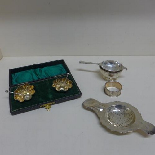 88 - A pair of silver salts boxed and two silver strainers, one with dish and a silver napkin ring - tota... 