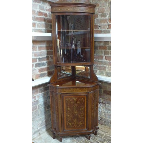 271 - A good quality Edwardian mahogany and inlaid corner cabinet with a bow fronted glazed door