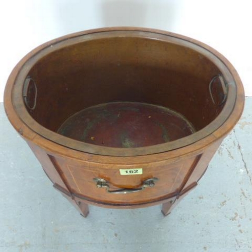 580 - A 19th century oval mahogany and inlaid wine cooler with a brass liner - Width 38cm x Height 46cm