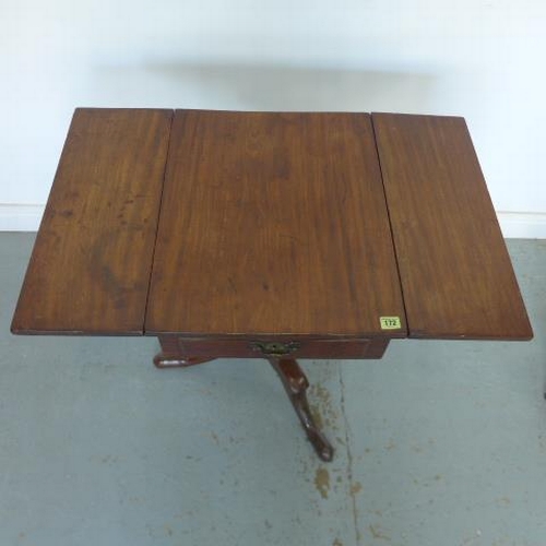 585 - A Georgian mahogany drop flap side table with two opposing drawers raised on a gun barrel base with ... 