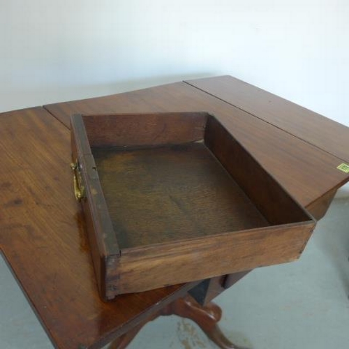 585 - A Georgian mahogany drop flap side table with two opposing drawers raised on a gun barrel base with ... 