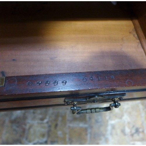 584 - A late 19th century arts and crafts mahogany breakfront desk with nine drawers - one drawer stamped ... 